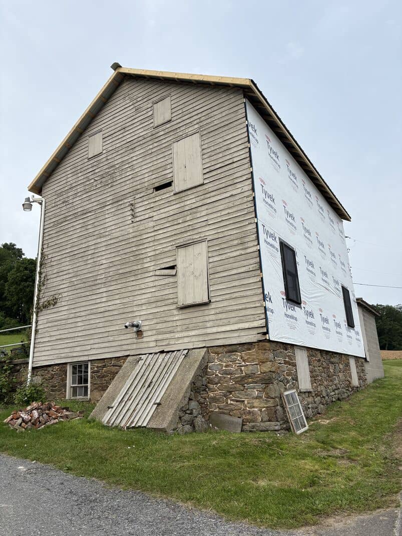 old barn in need of new roof and siding