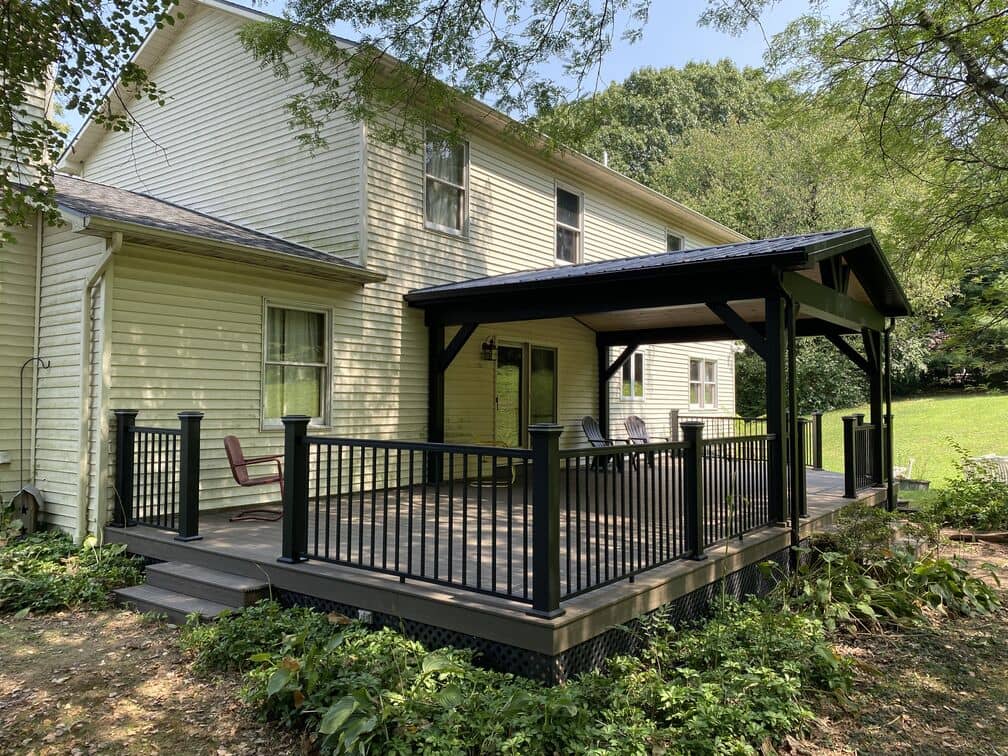 new deck with a pavilion attached to the back of the house